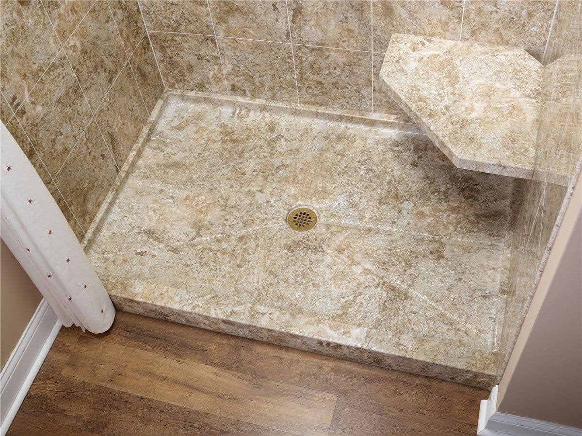 Ceramic tile shower base with drain and wooden step leading to wood flooring